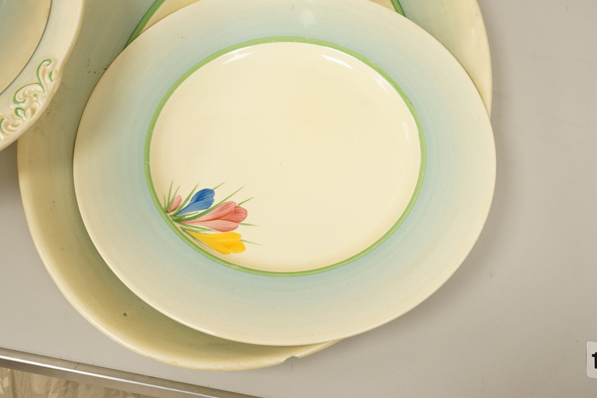 A collection of Clarice Cliff, Newport Pottery and Spring Crocus pattern tableware